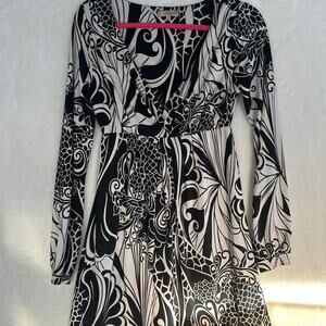 Loona Paris black and white babydoll dress with long sleeves. Size: 2